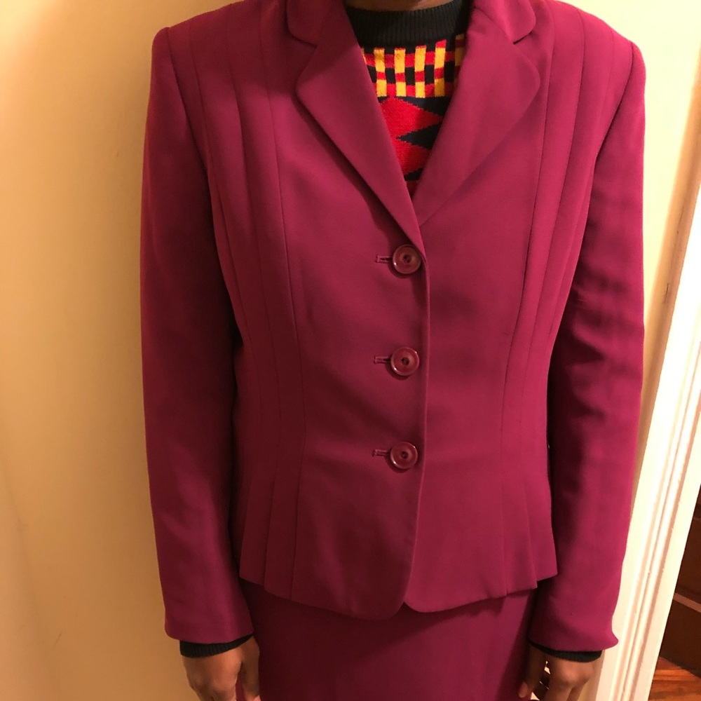 Lightly worn, full burgundy skirt suit. Size 14